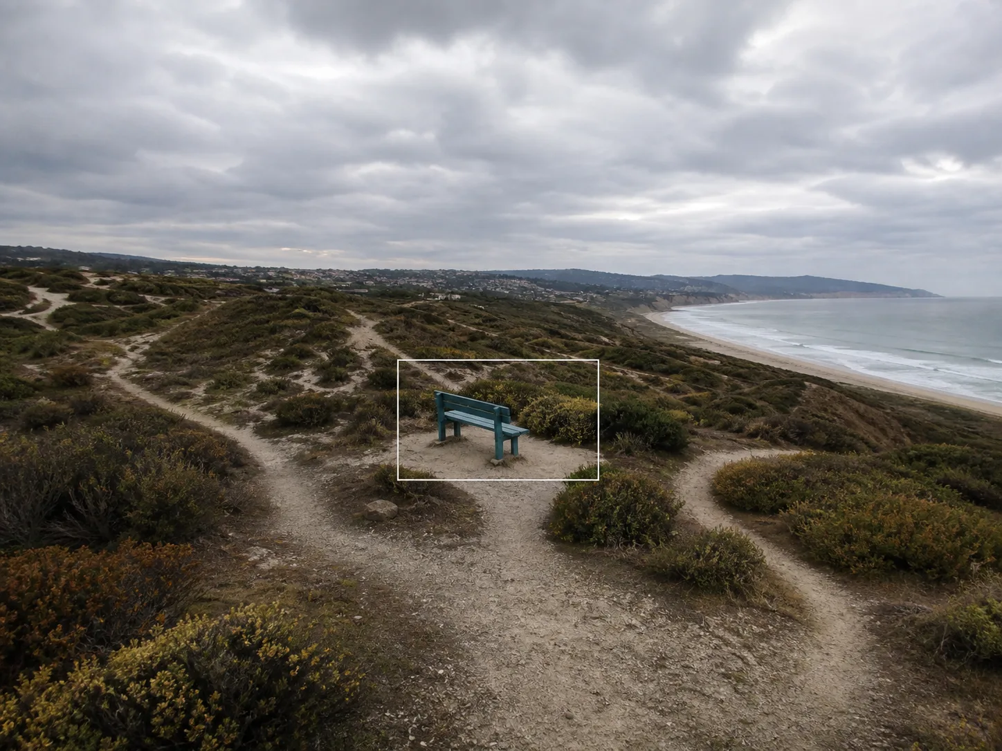 Avoid extreme extension with a tiny source boundary and a large invented coastline, dunes, paths, and distant buildings