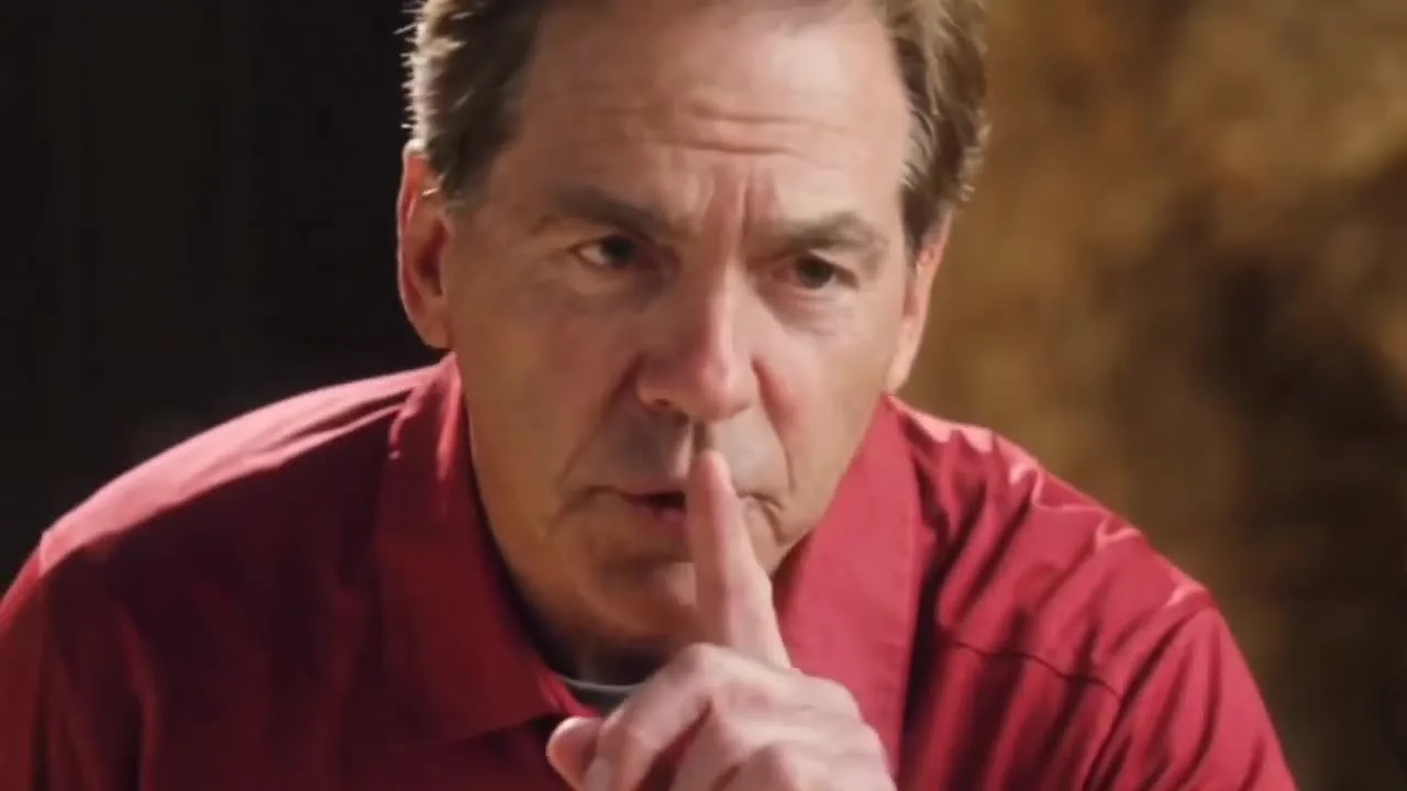 Close-up from a Rumpelstiltskin AI video where the recast little man raises a finger to his lips